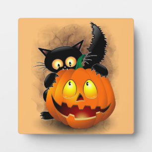 かわいい猫のハロウィンキャラクターがカボチャをかじっている フォトプラーク