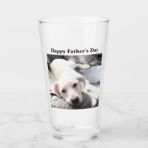 かわいい白犬のぶら下がったパパ姿の写真