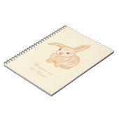 かわいい茶色のウサギ - ベージュの背景に透明。 ノートブック (左側)