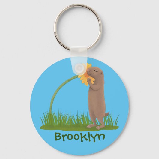 かわいい草原の犬が花漫画を嗅ぐ キーホルダー (正面)