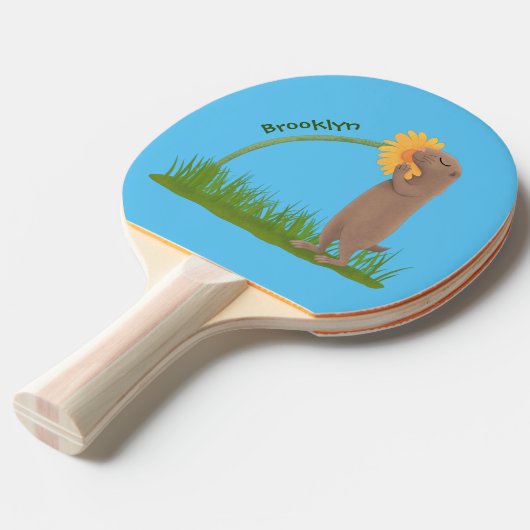 かわいい草原の犬が花漫画を嗅ぐ 卓球ラケット (正面アングル)