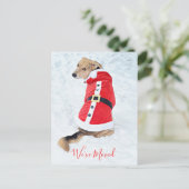 かわいい赤いサンタスーツを着た、動く予算のあるクリスマスドッグ ポストカード (スタンド正面)
