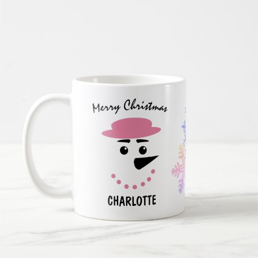 かわいい雪だるまの帽子をかぶった帽子。メリークリスマス コーヒーマグカップ (左)