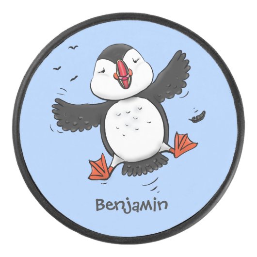 かわいい飛んでいるハッピーパフィン青い漫画イラストレーション アイスホッケーパック (正面)