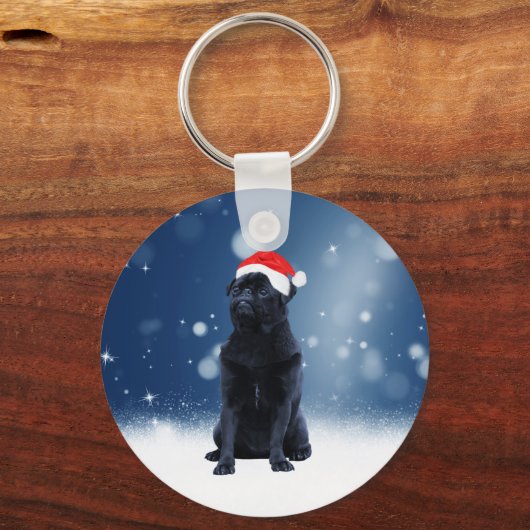 かわいい黒いパグドッグクリスマスサンタハット雪の星 キーホルダー (正面)