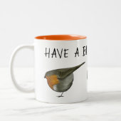 かわいく赤いロビン鳥のコーヒー・マグのイラストレーション ツートーンマグカップ (左)