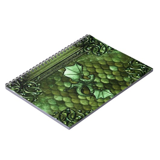 かわいらしい緑ドラゴンのはかりで測られた古代巻の魔法の本 ノートブック (左側)