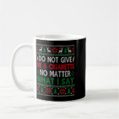 くそったれクリスマス 何言おうがタバコくれるな コーヒーマグカップ (左)