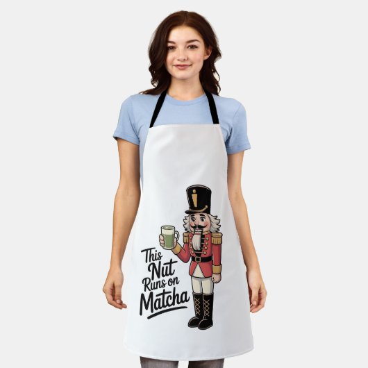 このナットは抹茶走クリスマスナツクラッカーの上にある エプロン (着用した状態)