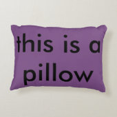 、"これあります枕"が紫色の枕"押しつぶして下さい" アクセントクッション (裏面)