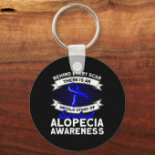 すべての傷跡の後ろに語らない物語のサポートAlopecia Aw キーホルダー (正面)