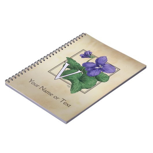 すみれ色の花のアルファベットのモノグラムのためのV ノートブック (左側)