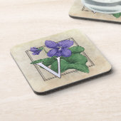 すみれ色の花のモノグラムのためのV コースター (左側)