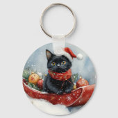 そりで雪遊びする黒猫のクリスマスデザイン キーホルダー (裏面)