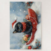 そりで雪遊びする黒猫 雪降るクリスマス ジグソーパズル (縦)