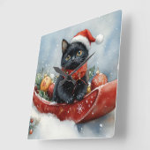 そりで雪遊びする黒猫 雪降るクリスマス スクエア壁時計 (傾斜)