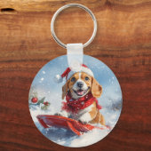 そりに乗ったビーグル犬 雪を降らせて クリスマス キーホルダー (裏面)