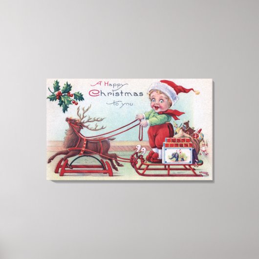 そりに乗って少年に幸せなクリスマス キャンバスプリント (正面)
