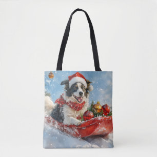 そり犬のボーダーコリー 雪を降らせて クリスマスのデザイン トートバッグ