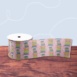 たくさんの本と小さな花が咲くピンクリボン サテンリボン