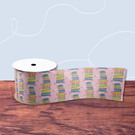 たくさんの本と小さな花が咲くピンクリボン サテンリボン