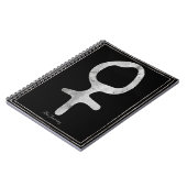 たたく銀の様式化された惑星ビーナスのシンボル ノートブック (左側)