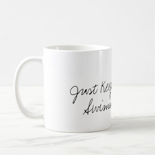 "ちょうど水泳"の金魚のコーヒー・マグ保って下さい コーヒーマグカップ (左)