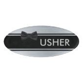 ちょうネクタイの名札が付いている黒そして銀 名札 (正面)