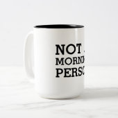 ない朝人のおもしろいな白黒 ツートーンマグカップ (正面左)