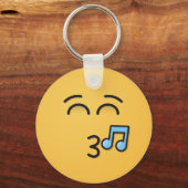 にこやかな目で口笛顔 キーホルダー (正面)