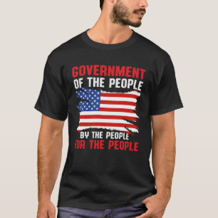 ~によるアメリカの愛国的政府 Tシャツ
