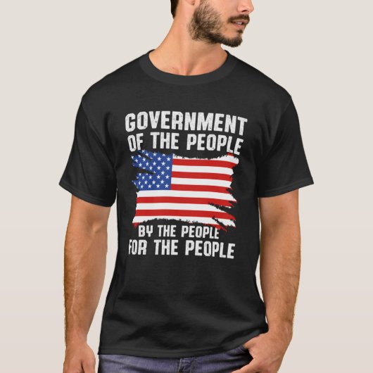 ~によるアメリカの愛国的政府 Tシャツ (正面)