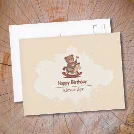 ぬいぐるみのクマがゆらゆら揺れる木馬に乗っている ポストカード