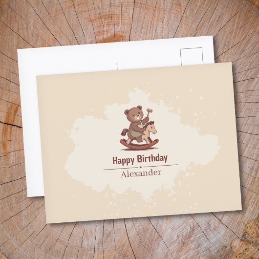 ぬいぐるみのクマがゆらゆら揺れる木馬に乗っている ポストカード