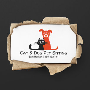 のペットの世話を坐らせている黒猫および赤い犬ペット 名刺