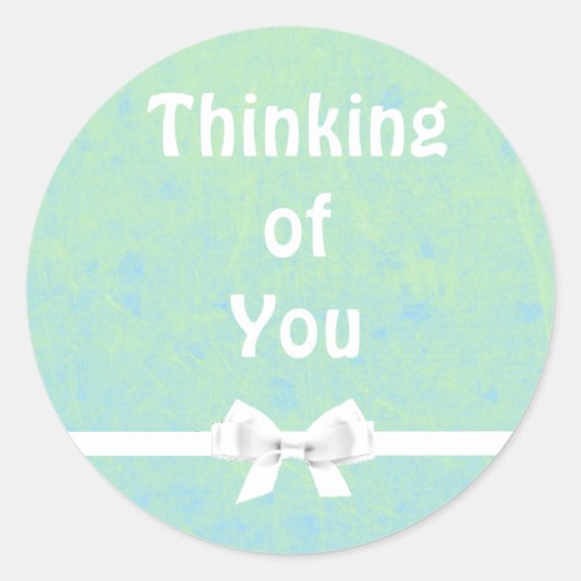 の考えティール（緑がかった色）とホワイトボウのシール ラウンドシール (正面)