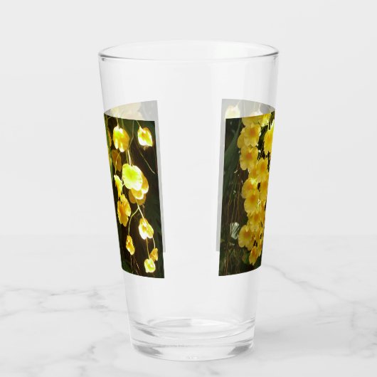 の黄色ぶら下がったい蘭の熱帯花 タンブラーグラス (左)