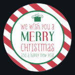 はっきりしたストライプMerry Christmasのステッカー ラウンドシール<br><div class="desc">赤と白のデザインはっきりした、プレゼントのグラフィックストライプー、おもしろいタイプライズの「メリークリスマスと新年をお祈り申し上げる」という言葉を使ったキュートなクリスマスシールの「The Spotted Olive™」。愛らしい！Copyright © 2014 The Spotted Olive™All Rights Reserved.</div>