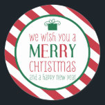 はっきりしたストライプMerry Christmasのステッカー ラウンドシール<br><div class="desc">赤と白のデザインはっきりした、プレゼントのグラフィックストライプー、おもしろいタイプライズの「メリークリスマスと新年をお祈り申し上げる」という言葉を使ったキュートなクリスマスシールの「The Spotted Olive™」。愛らしい！Copyright © 2014 The Spotted Olive™All Rights Reserved.</div>