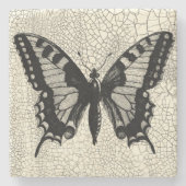 ひび割れた背景に黒と白の蝶 ストーンコースター (正面)