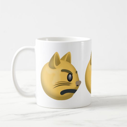 ふくれっ面をする猫の顔Emoji コーヒーマグカップ (左)