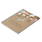 ぶら下がったなおり及び瓶ノート、ベビーシャワーのアドバイス ノートブック (左側)