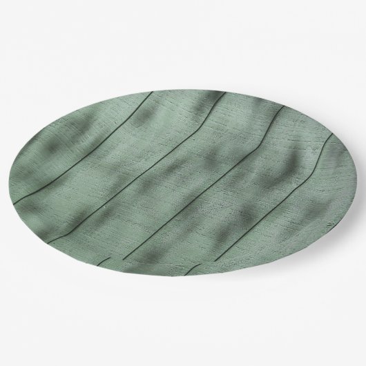 まだらにされた影またはライトが付いている素朴な緑の木製の壁 ペーパープレート (アングル)