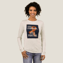 "まだ立ち向かう。闘い続ける。」Tシャツ