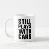 まだ遊車を持つ コーヒーマグカップ (左)