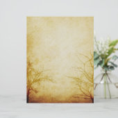 むき出しの木の枝からかえる老朽化した紙スクラップブック (スタンド正面)