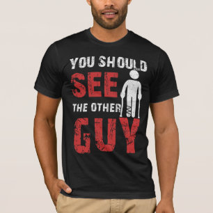 もう一人の男が脚の腕を折るのが見えるはずだ Tシャツ