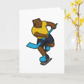 アイスホッケーのアイスホッケースティックを持つクマ カード (黄色い花)