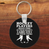 アイスホッケーゴアリーホッケー選手がテイで火を放つ キーホルダー (正面)