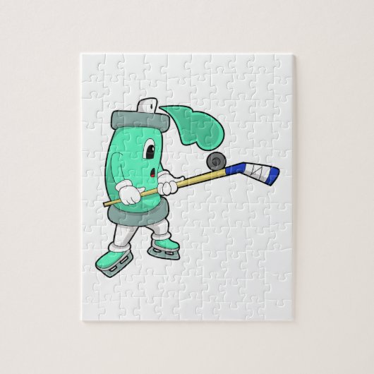 アイスホッケースティックとアイスホッケーでのアイススプレー ジグソーパズル (縦)